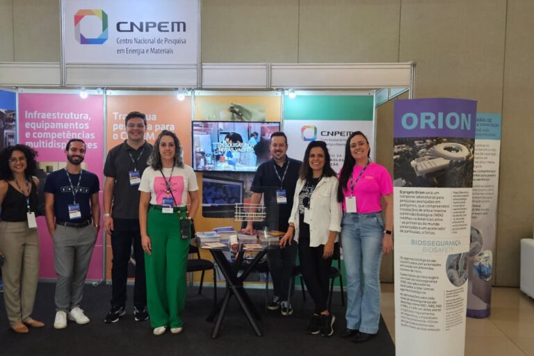 Legend: CNPEM booth with team of staff from the Center. Project Orion was a highlight in conversations with visitors (Photo credit: CNPEM Outreach)